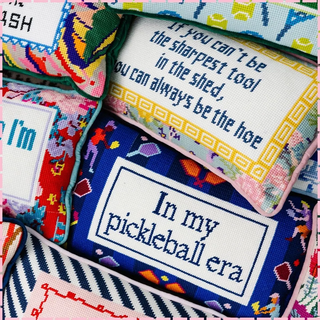 Collection of colorful cross-stitched patches with humorous text | Speakeasy Needle Works | Dallas, TX
