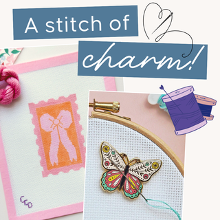 Embroidery hoop with butterfly design and text 'A stitch of charm!' on a light background | Speakeasy Needle Works | Dallas, TX