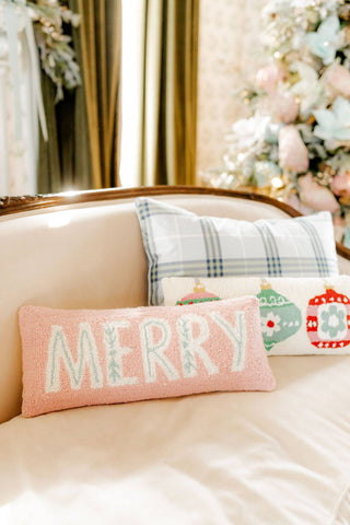 Decorative pillows on a couch with 'MERRY' text in a festive setting.  Whatsoever Things, Dallas, TX | Customized Decor, Apparel and Gifts for Women and Children 