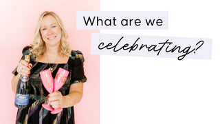 Woman holding a bottle and a pink object with text 'What are we celebrating?' on a pink background | Whatsoever Things Personalized Gifts