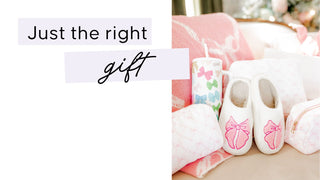 White slippers  with decorative elements on a pink blanket, with text 'Just the right gift'. | Whatsoever Things Personalized Gifts
